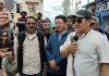 President of Merchang Association, Leh Tserign ANgchuk addressing traders before reopening of shops at Leh on Wednesday.