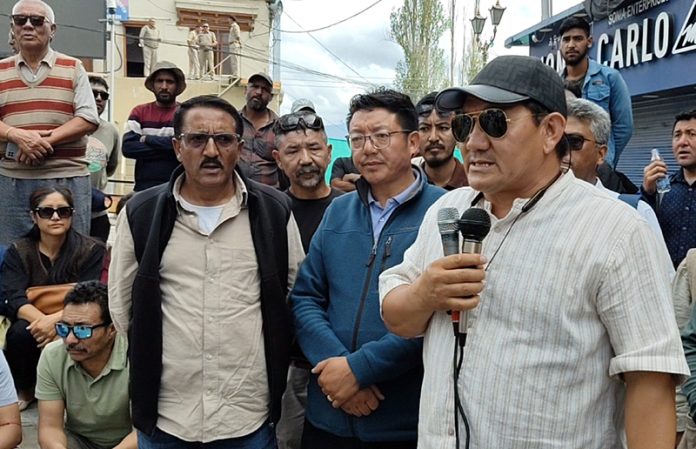 President of Merchang Association, Leh Tserign ANgchuk addressing traders before reopening of shops at Leh on Wednesday.