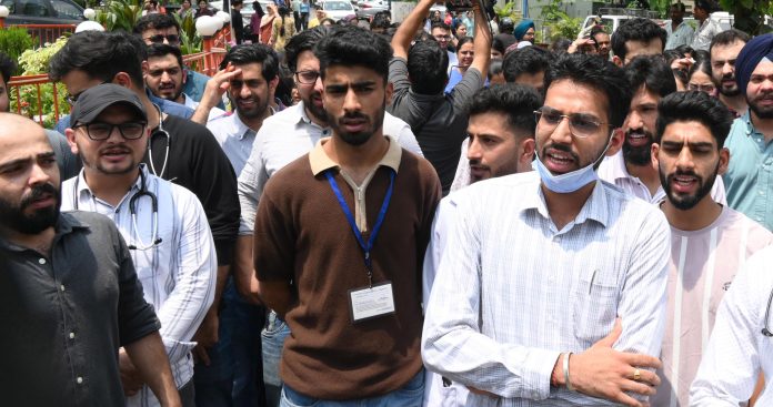 Resident doctors during a protest demonstration in GMC Jammu on Thursday. — Excelsior/Rakesh