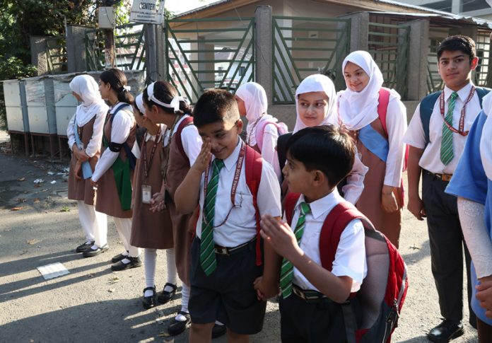 As summer break ends, children heading towards their schools in Srinagar early Tuesday morning. — Excelsior/Shakeel As summer break ends, children heading towards their schools in Srinagar early Tuesday morning. — Excelsior/Shakeel
