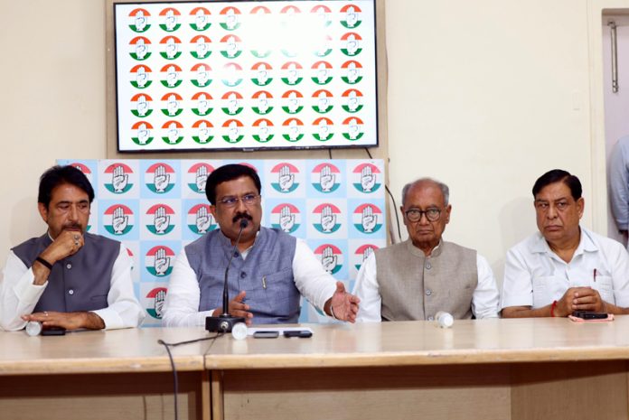 AICC general secretary Dr Naseer Hussain flanked by others addressing press conference at party office in New Delhi on Wednesday.