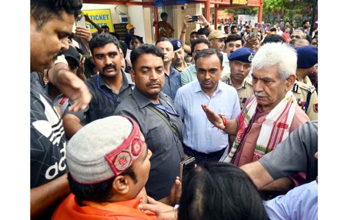 LG Manoj Sinha interacting with Shri Amarnath pilgrims at yatra base camp in Bhagwati Nagar, Jammu on Tuesday. Another pic on page 2.