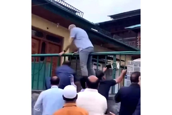 CM Omar Abdullah scales wall to enter ‘martyrs’ graveyard’ in Srinagar on Monday.