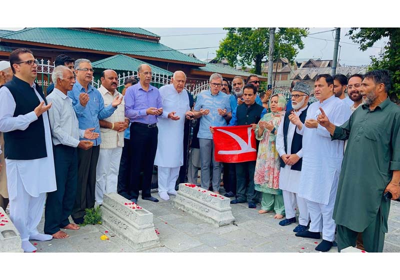 Chief Minister Omar Abdullah, NC president Dr Farooq Abdullah and others offer Fateha at the graveyard at Naqashband Sahib shrine in Downtown Srinagar on Monday. 
