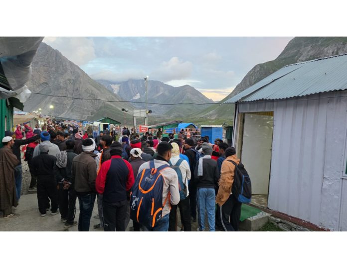 Pilgrims waiting at an entry gate to leave for darshan of holy cave at Panchtarni on Tuesday. Pilgrims waiting at an entry gate to leave for darshan of holy cave at Panchtarni on Tuesday.