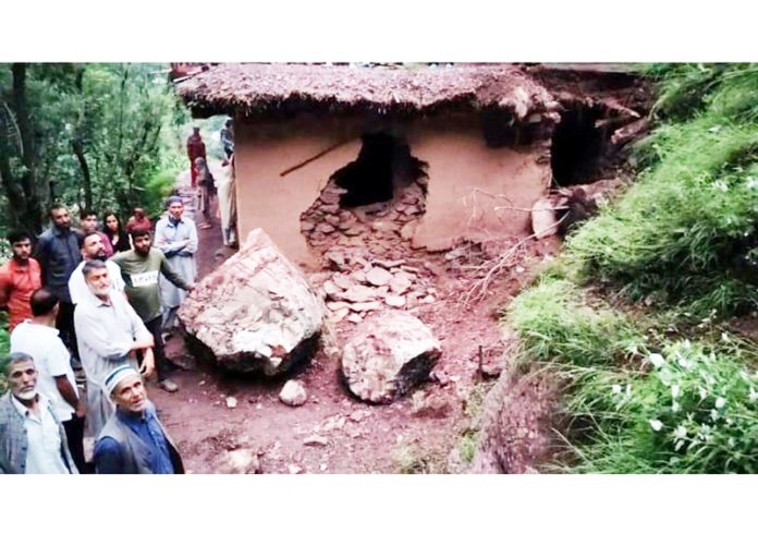 A house damaged due to boulders that rolled down from a hill in village Ajamabad of Mandi tehsil in Poonch district. Excelsior/Ramesh Bali