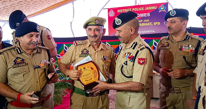 DGP Nalin Prabhat felicitating SHO Nagrota Inspector Parvez Sajjad on Tuesday.