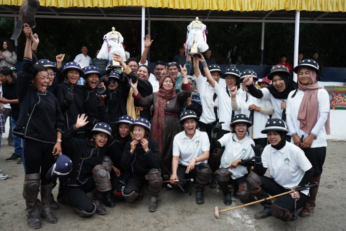 Polo teams posing for a group photograph with trophies post match presentation. Polo teams posing for a group photograph with trophies post match presentation.