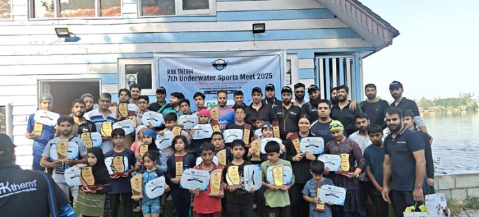Participants posing for a group photograph along with certificates.