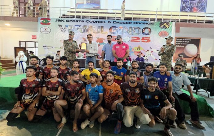 Dignitary presenting memento to a player in presence of a team at Varmul Gindo 2025. Dignitary presenting memento to a player in presence of a team at Varmul Gindo 2025.