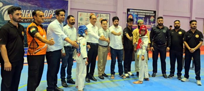 Taekwondo players posing along with dignitaries. Taekwondo players posing along with dignitaries.