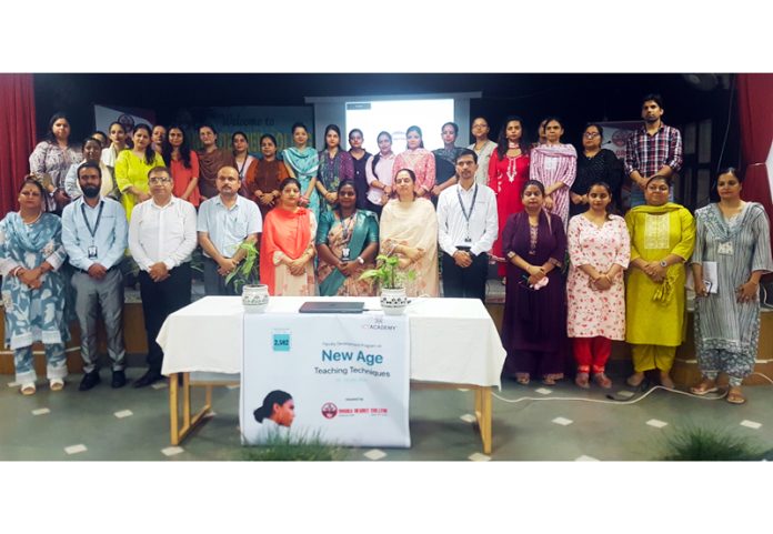 Dignitaries posing along with college faculty during a programme.