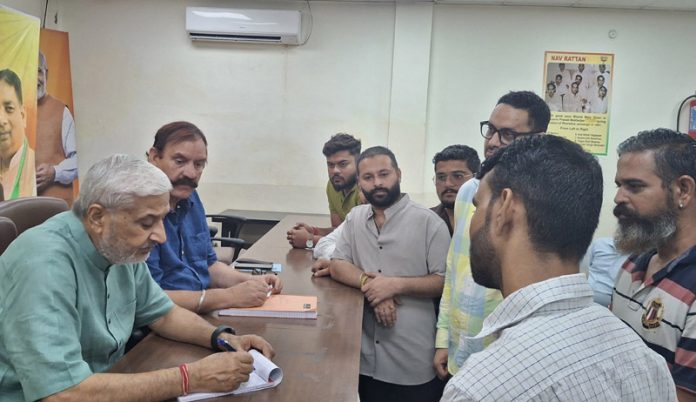 BJP MLA Jammu North, Sham Lal Sharma listening grievances of people at a public darbar at party office Jammu on Friday. BJP MLA Jammu North, Sham Lal Sharma listening grievances of people at a public darbar at party office Jammu on Friday.