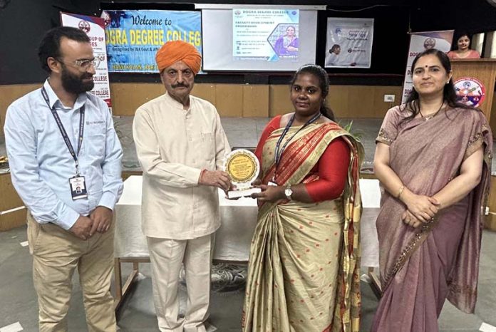 Chairman, Dogra Educational Trust, Th. Gulchain Singh Charak presents memento to Aruljothi A.P Soft, Skills Trainer during a function on Saturday.