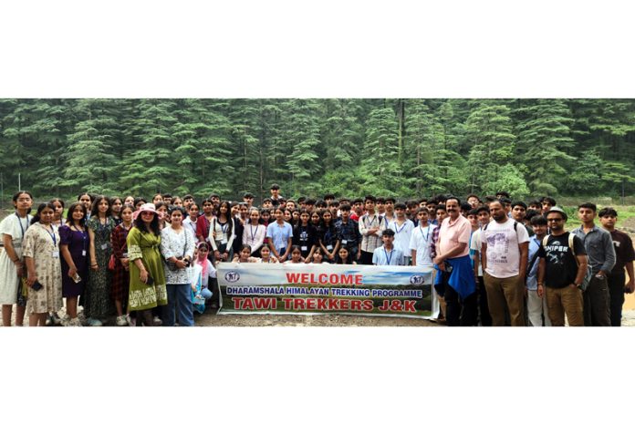 Students posing for a group photograph during a programme.