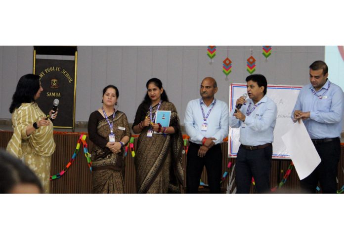 Dignitaries interacting during a workshop at APS Samba.