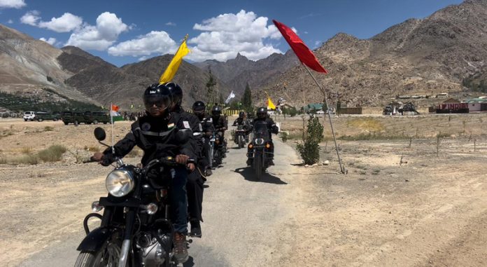 Bikers moving through Kumbathang to Randhawa during a rally. -Excelsior/Basharat Ladakhi