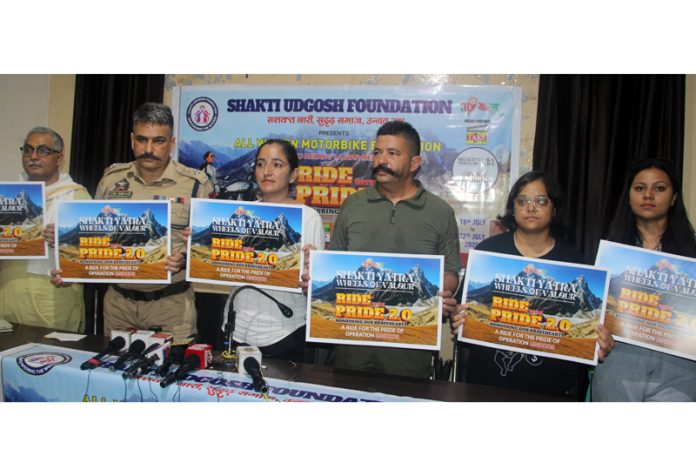 Dignitaries holding posters of Shakti Yatra 2.0 posing with Team Shakti Udghosh Foundation during jersey unveiling ceremony in Jammu. — Excelsior/Rakesh Dignitaries holding posters of Shakti Yatra 2.0 posing with Team Shakti Udghosh Foundation during jersey unveiling ceremony in Jammu. — Excelsior/Rakesh