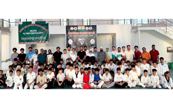 Dignitaries posing along with Taekwondo athletes in Poonch.