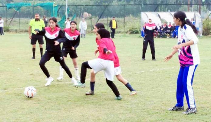 Football players in action during a match. Football players in action during a match.