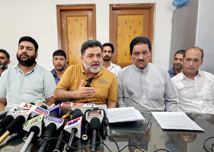 EJAC president, Wajahat Durani, along with other members during a press conference in Srinagar on Tuesday. -Excelsior/Shakeel EJAC president, Wajahat Durani, along with other members during a press conference in Srinagar on Tuesday. -Excelsior/Shakeel
