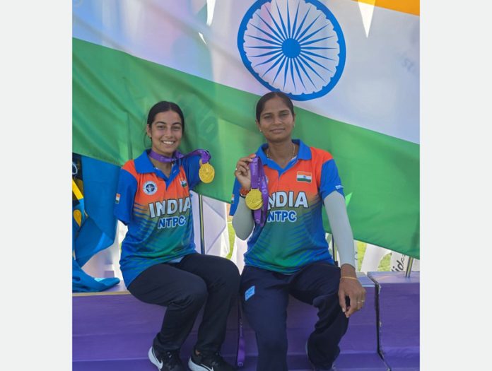 Sheetal Devi from J&K along with her partner Jyoti displaying gold medals.