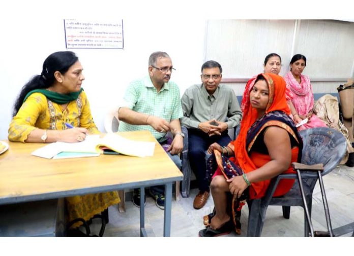 Dr Anita Gupta advising the specially abled persons during a camp in Jammu.