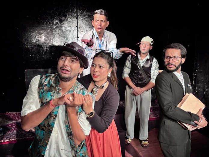 A scene from the play 'Ek Kalakriti' being staged in Jammu on Sunday.