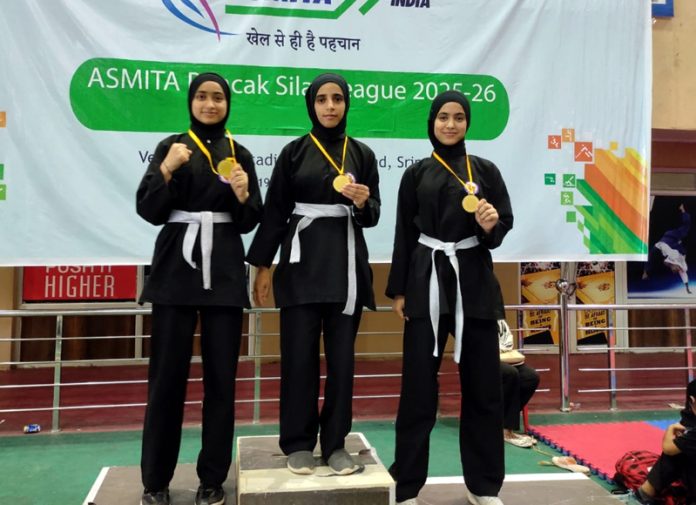 Winners posing with medals on podium at Asmita Pencak Silat League 2025.