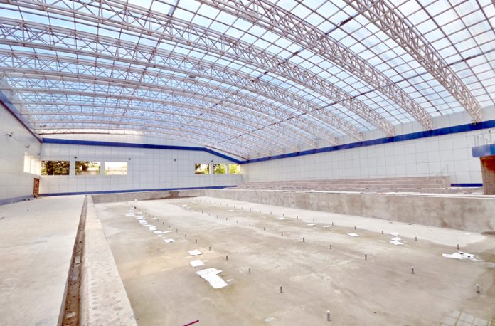 A view of the under-construction all-weather Swimming Pool at MA Stadium, Jammu. -Excelsior/Rakesh