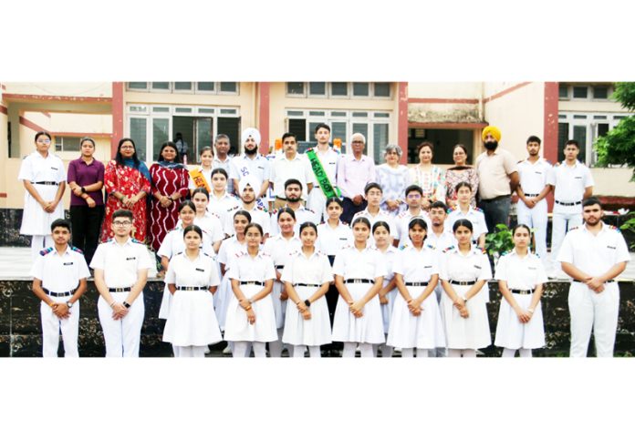 Newly elected Students Council posing for group photograph with dignitaries.