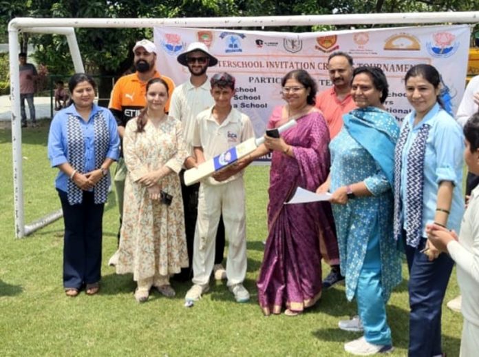 A dignitary presenting a bat to 'Player of the Match' during JKCA U-14 Boys Inter-School Cricket Tournament. A dignitary presenting a bat to 'Player of the Match' during JKCA U-14 Boys Inter-School Cricket Tournament.
