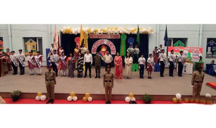 Students and management of Rich Harvest School along with guests during a function in school premises.