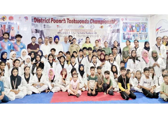 Taekwondo players posing along with dignitaries during closing ceremony in Poonch. Taekwondo players posing along with dignitaries during closing ceremony in Poonch.
