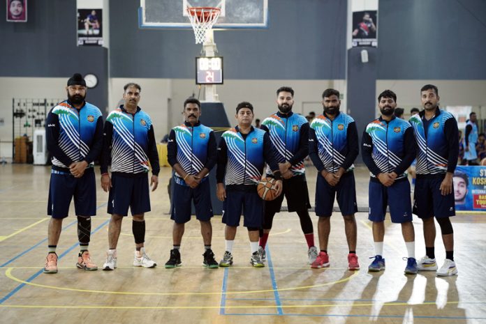 J&K Masters Basketball team posing for group photograph.