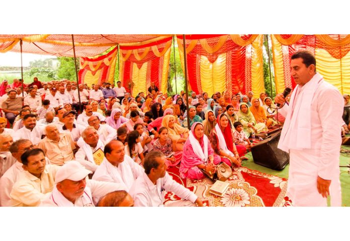 MLA Jasrota, Rajiv Jasrotia addressing a gathering at Budhi on Tuesday.