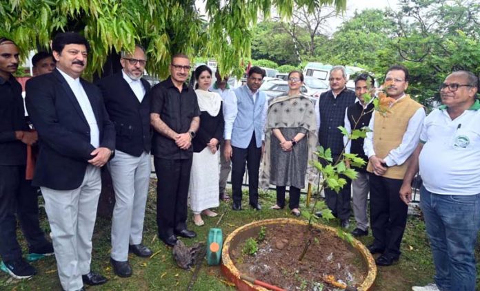 Judges, BAJ members, and other officers during a plantation drive at High Court complex in Jammu.