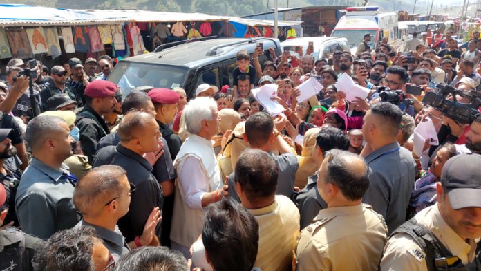 LG interacting with pilgrims at Baltal on Friday. —Excelsior/Firdous Ahmad LG interacting with pilgrims at Baltal on Friday. —Excelsior/Firdous Ahmad