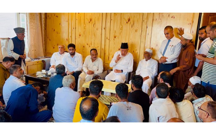 NC president Dr Farooq Abdullah interacting with a public gathering at Srinagar.