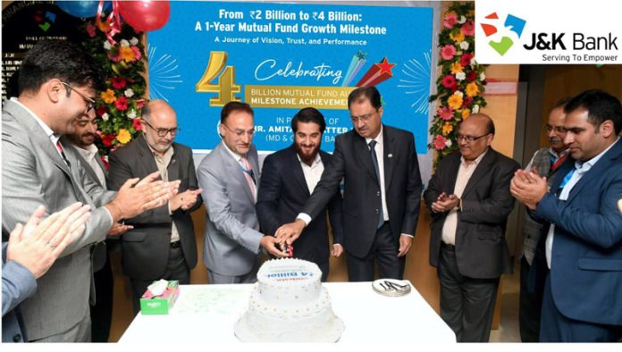 Dignitaries from J&K Bank celebrating JKBFSL's achievements by cutting a cake in Srinagar on Wednesday. Dignitaries from J&K Bank celebrating JKBFSL's achievements by cutting a cake in Srinagar on Wednesday.