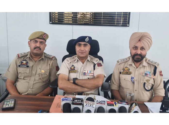 SP Headquarters Jammu Irshad Hussain Rather and other police officers during a press conference at Police Station Bishnah.