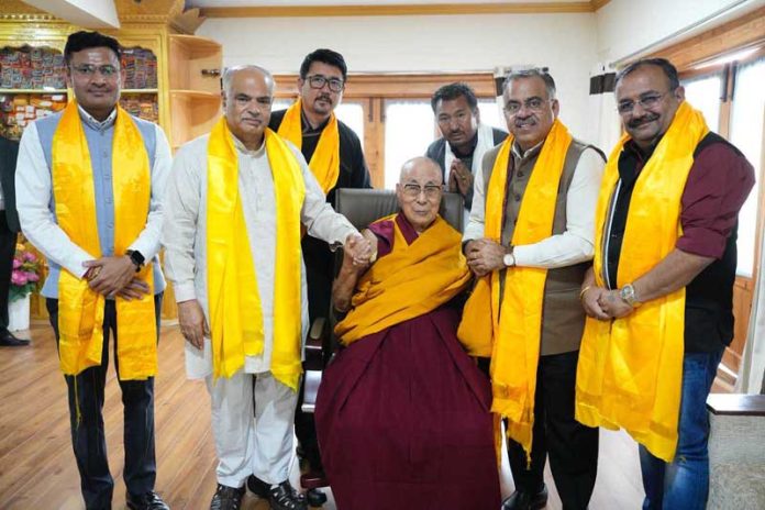 BJP leaders led by party national general secretary Tarun Chugh paying respects to Dalai Lama at Leh.