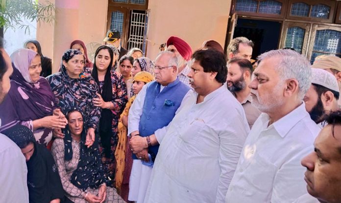 Tariq Hameed Karra, president JKPCC, working president Raman Bhalla and others interacting with family members of Parvez, killed in police firing.