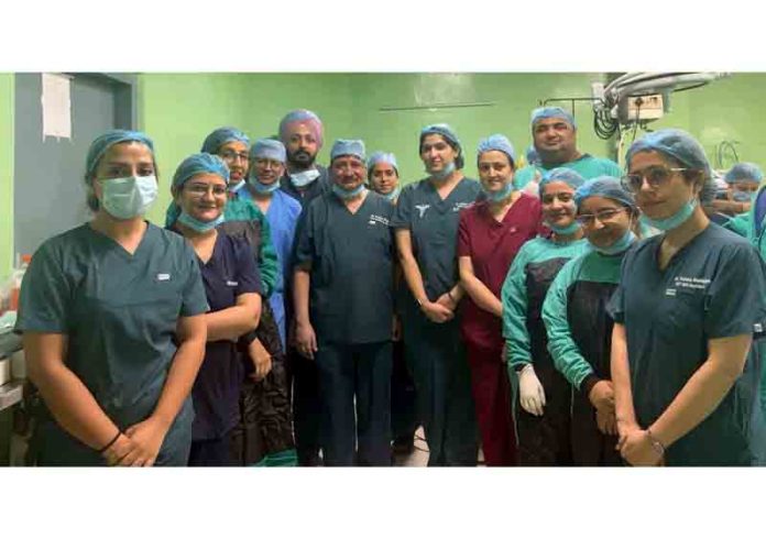 ASCOMS & Hospital team that performed a complex skull surgery posing for a group photograph.