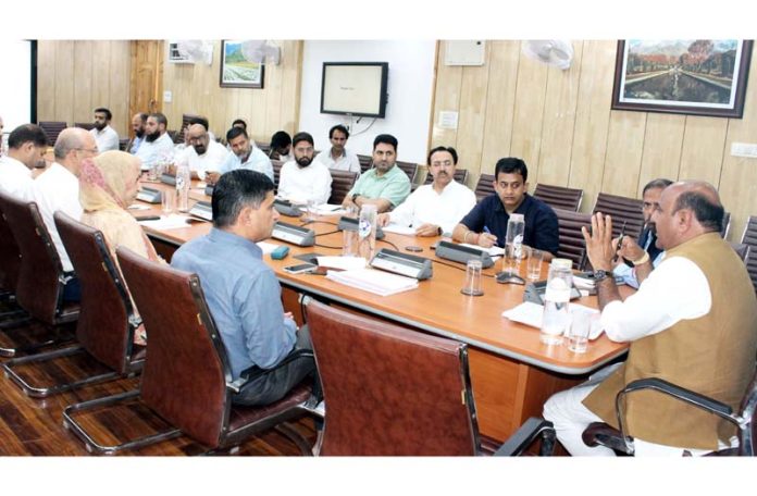 DyCM chairing a meeting at Srinagar on Wednesday.