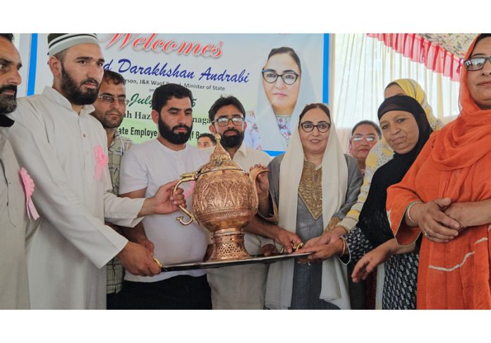 Waqf Board employees honouring Chairperson Dr Syed Darakhshan Andrabi during a program at Dargah Hazratbal, Srinagar.