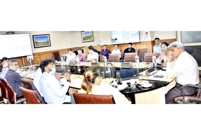 CS chairing a meeting at Srinagar on Sunday.