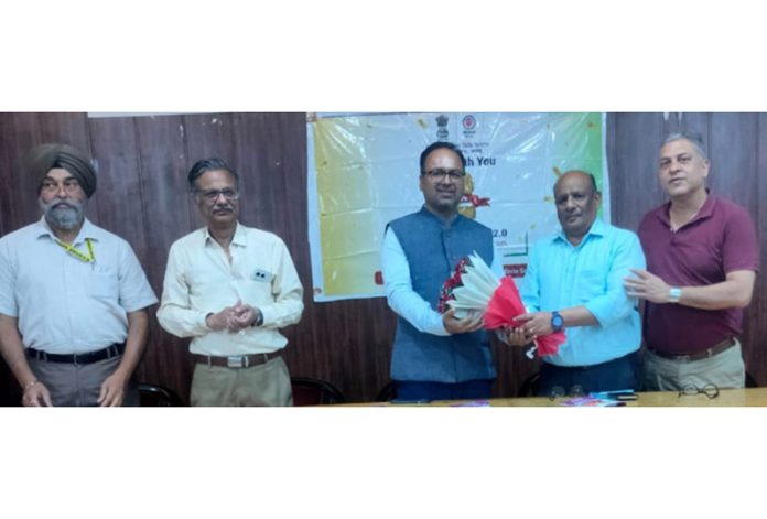 Regional Commissioner, PF Jammu, Sumit Singh, president AOI Gangyal, Virendra Jain and others during awareness program at Gangyal in Jammu on Monday.