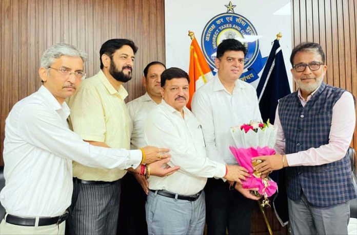 Members of the Tax Bar Association presenting bouquet to Commissioner, Pravin Chandra in Jammu.