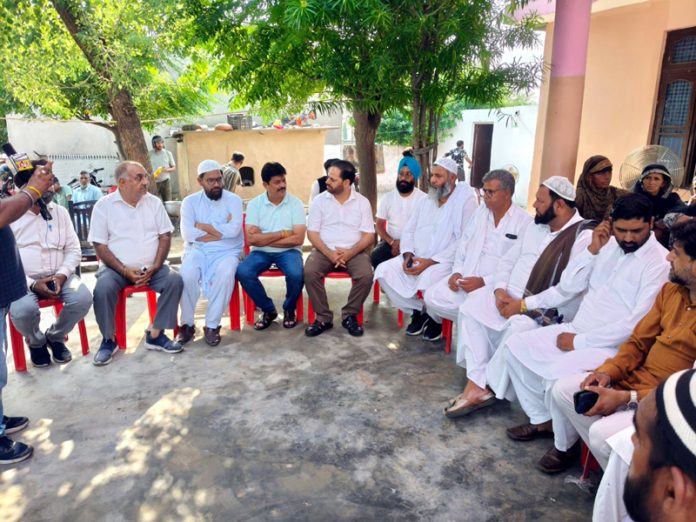CWC Member, Vikar Rasool Wani, accompanied by senior Cong leaders during visit to the residence of Mohd Parvez on Sunday.
